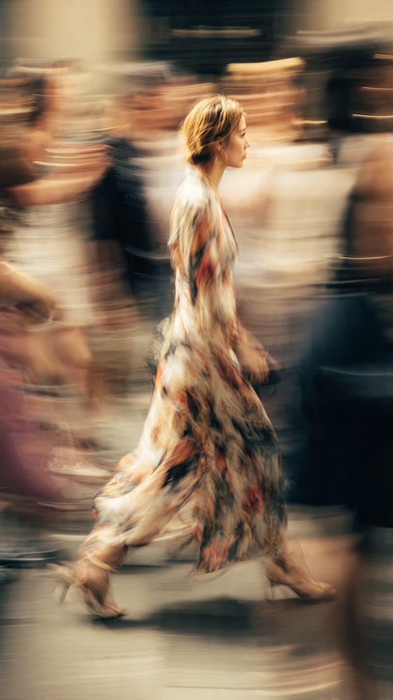 A panning photo of a female model mid walk - Output 4